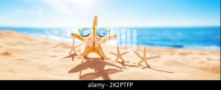 Starfishes on the beach sand in summer Stock Photo