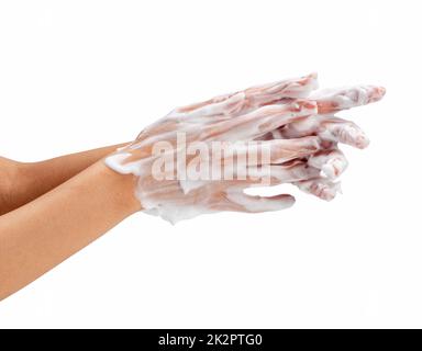 Female hand washing hands with soap lather on white background. Stock Photo