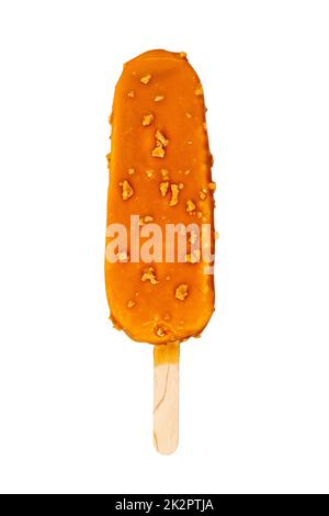 Ice cream on a stick in caramel glaze with nuts Stock Photo