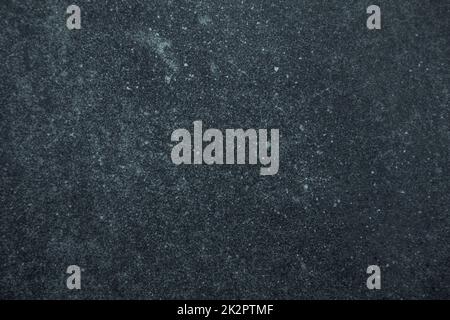 Dark worn blue and black stained surface background or texture Stock Photo
