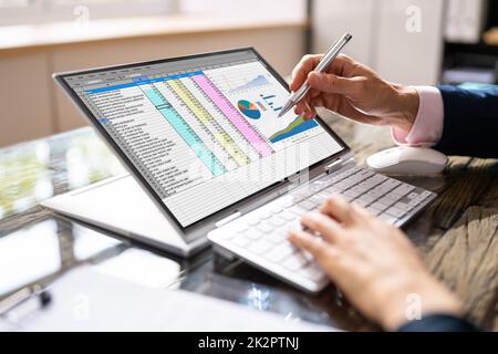 Analyst Employee Working On Spreadsheet Stock Photo