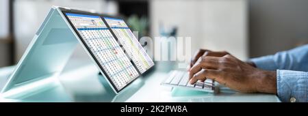 African American Analyst Using Spreadsheet Stock Photo
