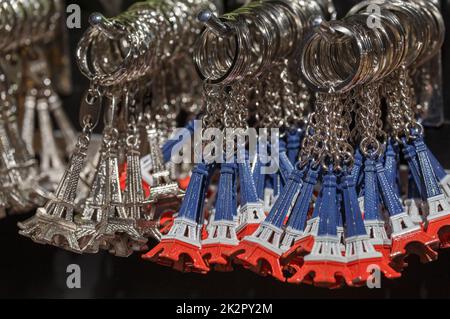 Small Eiffel towers souvenirs keyrings in Paris, France Stock Photo