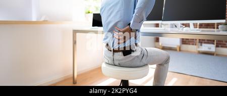 Businessman Suffering From Back Pain Stock Photo