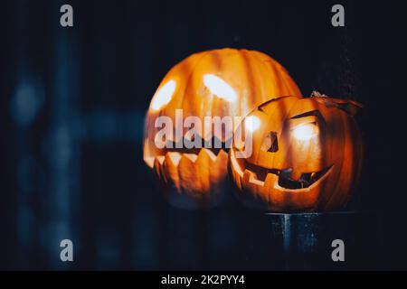 Two pumpkins carved for Halloween celebraiton Stock Photo