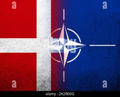 the Kingdom of Denmark National flag with Flag of North Atlantic Alliance NATO. Grunge Background Stock Photo