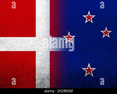 the Kingdom of Denmark National flag with National flag of New Zealand . Grunge Background Stock Photo