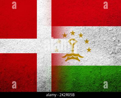 the Kingdom of Denmark National flag with The Republic of Tajikistan National flag. Grunge Background Stock Photo