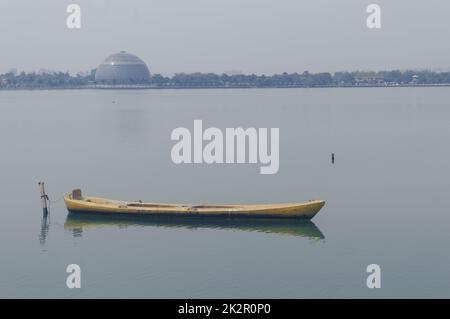 A small wooden boat moored in open water, off the Portuguese coast. stock  photo