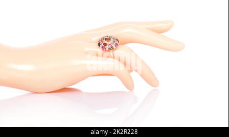 Tourmaline and Diamond Jewel or gems ring on plastic mannequin female finger. Collection of natural gemstones accessories. Studio shot Stock Photo
