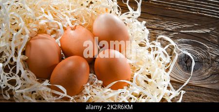 Composition with five chicken eggs on wood Stock Photo