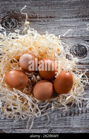 Composition with five chicken eggs on wood Stock Photo