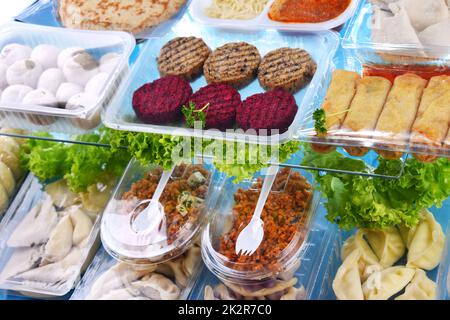 A variety of prepackaged food products in plastic boxes Stock Photo