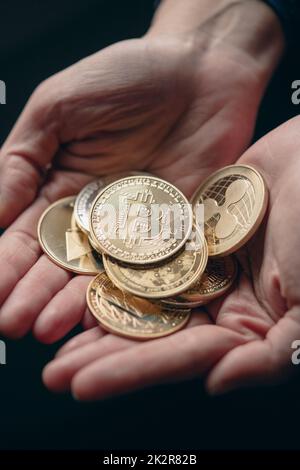 Silver and gold various digital cryptocurrency coins, with Bitcoin on top Stock Photo