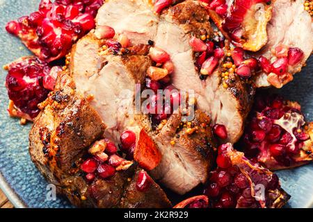 Pork roast in pomegranate marinade. Stock Photo