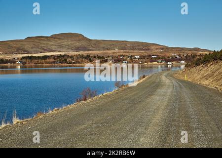 Gravel road in Iceland by a lakeside Stock Photo