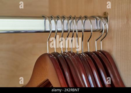 Empty hangers in a wardrobe Stock Photo