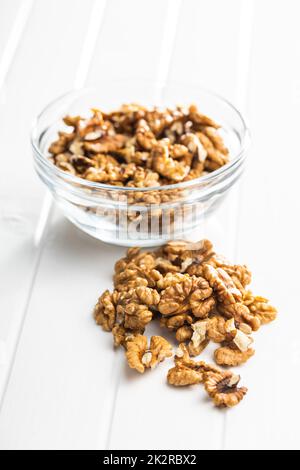 Peeled walnut kernels on white table. Stock Photo