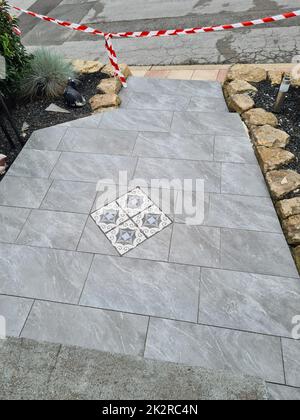 Laying floor tiles Stock Photo