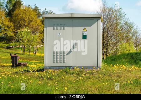 Outdoor electric high voltage distribution cabinet in a public park Stock Photo