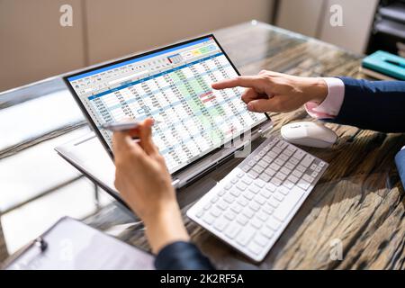Analyst Employee Working On Spreadsheet Stock Photo