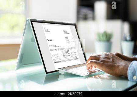 Young Businessman Using Laptop Stock Photo