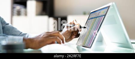 Electronic Spreadsheet Analyst Or Auditor Using Software Stock Photo