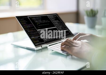 Programmer Or Coder At Office Desk Stock Photo