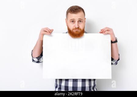 man with beard holding big white card. Stock Photo