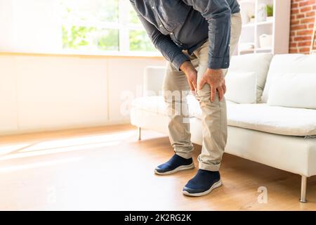 Man Having Knee Pain Stock Photo