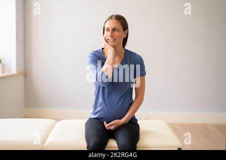 Pregnant Woman With Painful Expression Suffering From Toothache Stock Photo
