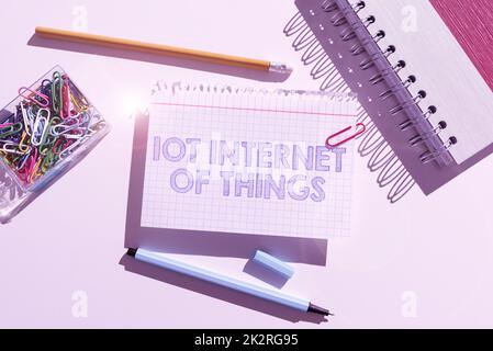 Hand writing sign Iot Internet Of Things. Word Written on Network of Physical Devices send and receive Data Stock Photo