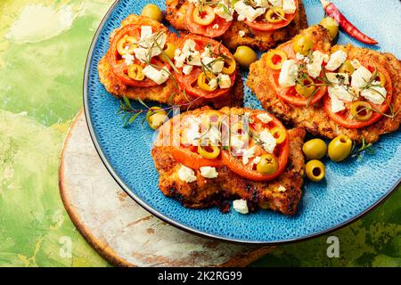 Pork schnitzel with olives Stock Photo