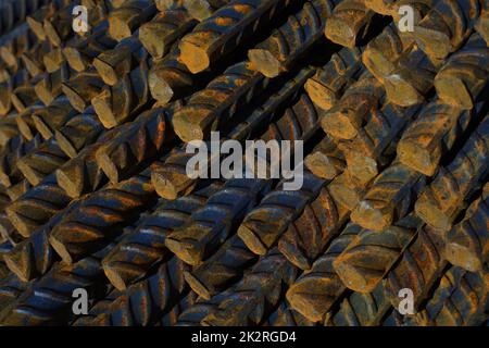metal reinforced concrete bars rusty rods stack close-up construction material Stock Photo