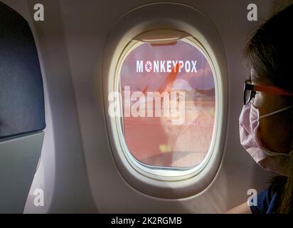Woman wear surgical mask sit on passenger seat near cabin window of the airplane with monkeypox outbreak concept. Monkeypox is caused by monkeypox virus. Traveling by plane during monkeypox outbreak.