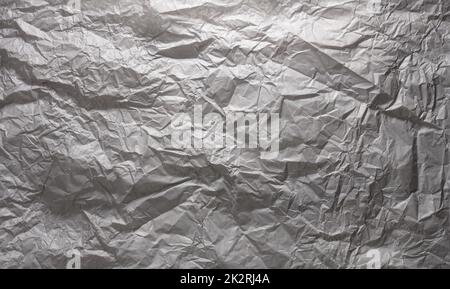 Texture of gray crumpled paper, background for the inscription Stock Photo