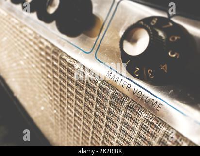 Close-up view of the knobs of an amplifier for adjusting the sound of stringed musical instruments Stock Photo