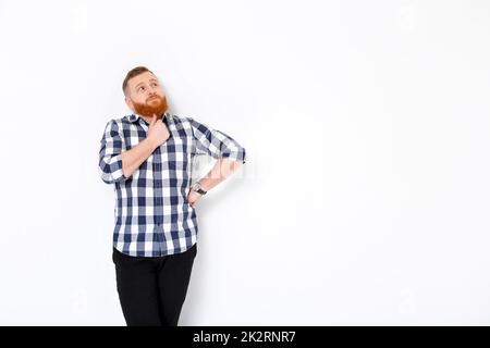 man with red hair and beard in plaid shirt Stock Photo