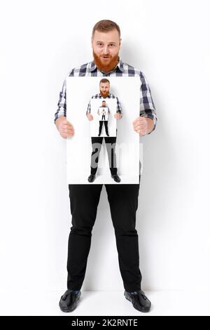 man with beard holding big white card. Stock Photo