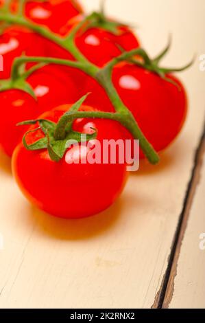 fresh cherry tomatoes on a cluster Stock Photo