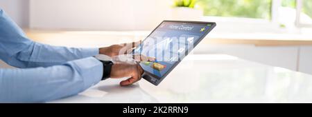 Person Using Home Control System On Tablet Stock Photo