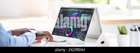 Businessman Analyzing Graph On Computer Stock Photo