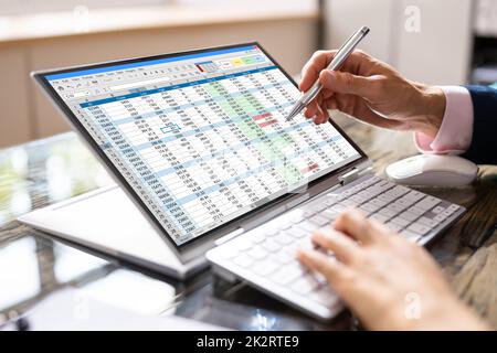 Analyst Employee Working On Spreadsheet Stock Photo