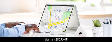 Man Browsing GPS Map On Laptop Stock Photo