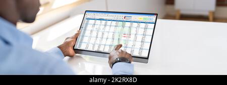 Electronic Spreadsheet Analyst Or Auditor Using Software Stock Photo