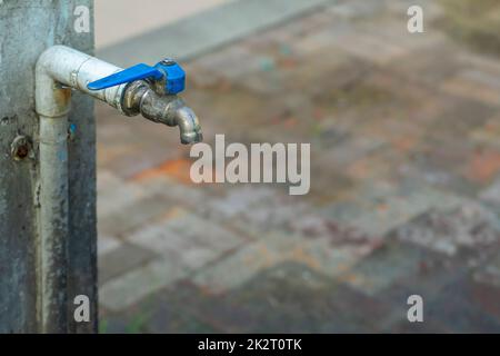 Old valve faucet of blue pipe water. Stock Photo