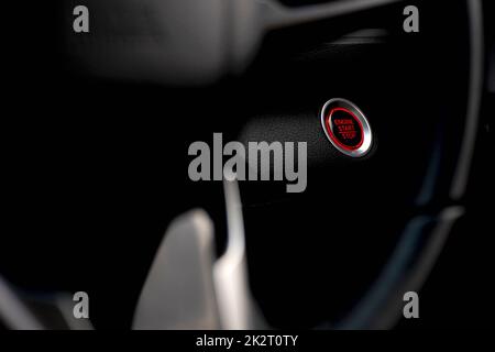 Start button in car engine red push Stock Photo