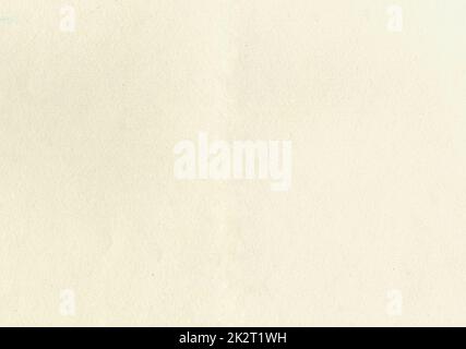 Large image paper texture background with aged uncoated fine fiber grain and dust particles sketch water color paper in light beige yellowed color smooth with copy space for text wallpapers or designs Stock Photo