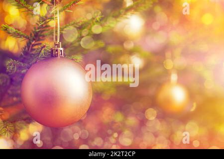 Christmas-tree decoration bauble on decorated Christmas tree bac Stock Photo