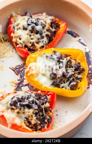 baked peppers filled with minced meat, rice, beans and cheese Stock Photo